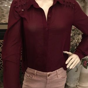 Blouse with metal spikes and open back!